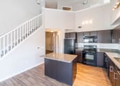 Thumbnail 13 of 26 - a kitchen with a counter top and a staircase  at Merion Riverwalk Apartment Homes, Shelton, 06484