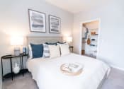 Thumbnail 7 of 26 - a bedroom with a bed and a closet at Merion Riverwalk Apartment Homes, Shelton, 06484