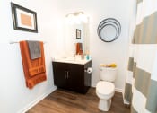 Thumbnail 16 of 26 - a bathroom with a shower and a toilet and a sink at Merion Riverwalk Apartment Homes, Shelton