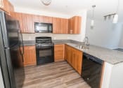 Thumbnail 12 of 27 - Fully Furnished Kitchen at Merion Stratford Apartment Homes, Connecticut
