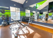 Thumbnail 2 of 27 - a gym with weights and a tv and windows at Merion Stratford Apartment Homes, Stratford