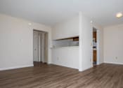 Thumbnail 27 of 27 - A room with wooden floors and white walls.