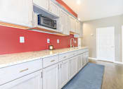 Thumbnail 14 of 20 - A kitchen with white cabinets at North Pointe Apartments, Clifton Park, NY, 12065