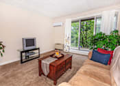Thumbnail 17 of 20 - Living Room With TV at North Pointe Apartments, Clifton Park