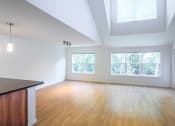 Thumbnail 26 of 27 - an empty living room with wood floors and a window at Merion Stratford Apartment Homes, Connecticut