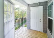 Thumbnail 15 of 27 - the entrance to a porch with a white door at Merion Stratford Apartment Homes, Stratford