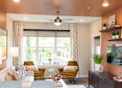 Thumbnail 1 of 20 - a living room with a large window and a ceiling fan at The Yards at Malvern, Malvern, PA