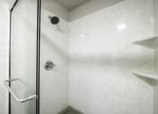 Thumbnail 28 of 29 - a large walk-in shower with a glass door in a bathroom