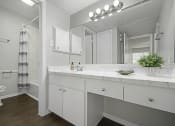 Thumbnail 11 of 17 - bright open bathroom with large countertop space