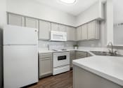 Thumbnail 14 of 15 - bright white clean kitchen with spacious countertop