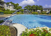Thumbnail 15 of 29 - relaxing fountains at the Prestonwood Hills swimming pool
