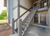 Thumbnail 24 of 28 - a stairway leading up to the front door of a house