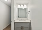 Thumbnail 17 of 41 - a bathroom with a sink and a mirror