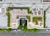 Thumbnail 22 of 22 - arial view of a building with greenery on the side of it