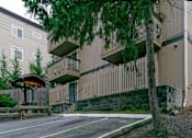 Thumbnail 4 of 5 - A tree is in front of a building.