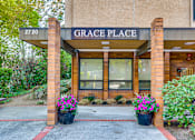 Thumbnail 5 of 18 - The front of a building called Grace Place with a sign above the entrance.