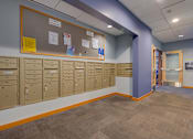 Thumbnail 8 of 27 - A hallway with a row of lockers on the wall.
