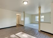 Thumbnail 22 of 33 - A room with a white ceiling and a window with a white frame.
