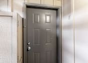 Thumbnail 21 of 29 - A black door with a silver handle and a number 8 on the wall.