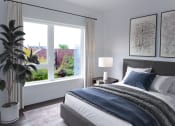 Thumbnail 14 of 34 - a bedroom with a bed and a large window