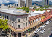 Thumbnail 20 of 22 - an aerial view of a building on a city street