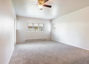 Thumbnail 22 of 40 - an empty room with a ceiling fan and a window