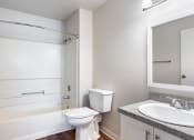 Thumbnail 31 of 40 - a bathroom with a toilet sink and bathtub