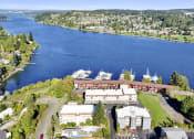 Thumbnail 19 of 20 - an aerial view of a city and a body of water