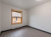 Thumbnail 20 of 24 - A room with a window and a heater on the floor.