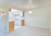 Thumbnail 8 of 18 - A kitchen with white cabinets and a white dishwasher.