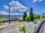 Thumbnail 3 of 40 - A street view with a clear sky and a few clouds.