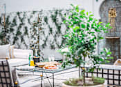 Thumbnail 36 of 36 - Courtyard Patio at Villa Carlotta – Furnished Apartments, Los Angeles, CA