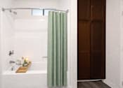 Thumbnail 6 of 20 - photo of bathroom bath tub with green curtain