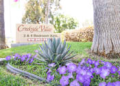 Thumbnail 1 of 20 - A sign for Creekside Villas with a phone number and a picture of a tree.