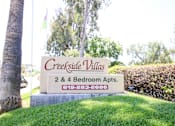 Thumbnail 16 of 20 - A sign for Creekside Villas 2 & 4 Bedroom Apts.