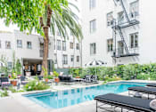 Thumbnail 14 of 36 - Pool View at Villa Carlotta – Furnished Apartments, Los Angeles, CA