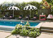Thumbnail 15 of 36 - Pool And Sundecks at Villa Carlotta – Furnished Apartments, California