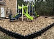 Thumbnail 12 of 12 - a playground with a set of slides and other playground equipment