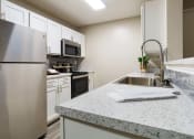 Thumbnail 5 of 33 - Granite Countertop Kitchen at Terraces at Southaven, Southaven, 38671