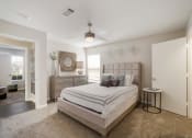 Thumbnail 11 of 33 - Bedroom area with bed and window at The Luxe of Southaven, Southaven, Mississippi