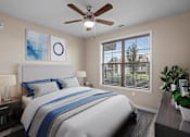 Thumbnail 9 of 50 - a bedroom with a large bed and a ceiling fan at The Dorset, Kansas City, Missouri