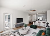Thumbnail 1 of 23 - Living room with a ceiling fan, balcony entrance door, hardwood floors, and a modern kitchen in the background at Mirabelle Luxury Apartments, Kansas City 64111
