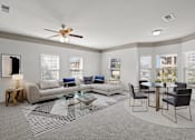 Thumbnail 30 of 59 - a living room with a couch a table and a ceiling fan at Stonepost Crossing Apartments, Overland Park, KS, 66213
