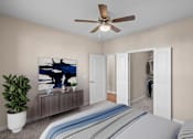 Thumbnail 11 of 50 - a bedroom with a large bed and a ceiling fan at The Dorset, Kansas City, 64112
