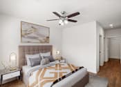 Thumbnail 10 of 23 - A bedroom with a ceiling fan and hallway closet at Mirabelle Luxury Apartments, Missouri, 64111