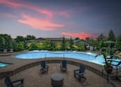 Thumbnail 50 of 59 - A beautiful outdoor swimming pool area with lounge chairs and a hot tub at Stonepost Crossing Apartments, Overland Park, Kansas