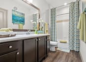 Thumbnail 19 of 59 - a bathroom with a sink toilet and shower at Stonepost Crossing Apartments, Overland Park, 66213