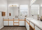 Thumbnail 28 of 57 - A large bathroom with a ton of counter space and under the sink storage. at Crescent Apartment Homes, Lenexa, 66219