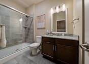 Thumbnail 48 of 50 - Guest suite bathroom at The Dorset featuring walk-in glass shower, vanity, and modern finishes