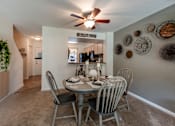 Thumbnail 2 of 9 - Dining table with breakfast bar looking into the kitchen at Fords Pointe Apartments